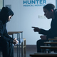 Jared Leto sits with Morbius director Daniel Espinosa on a hospital set to discuss a scene.